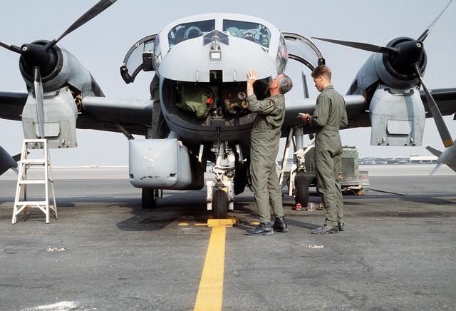 Checking the systems of OV-1D before sortie.
